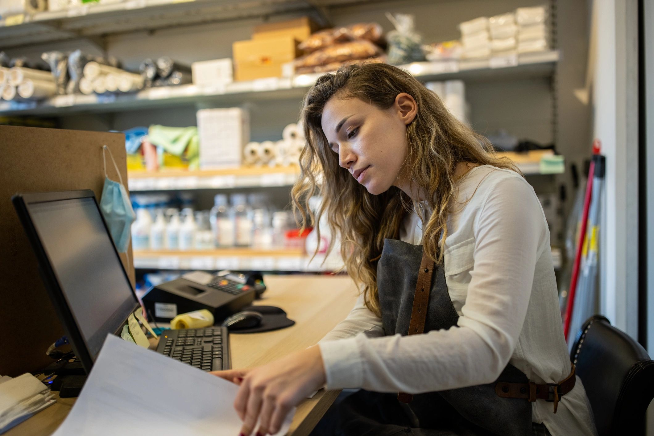 Retail store owner working with inventory and orders