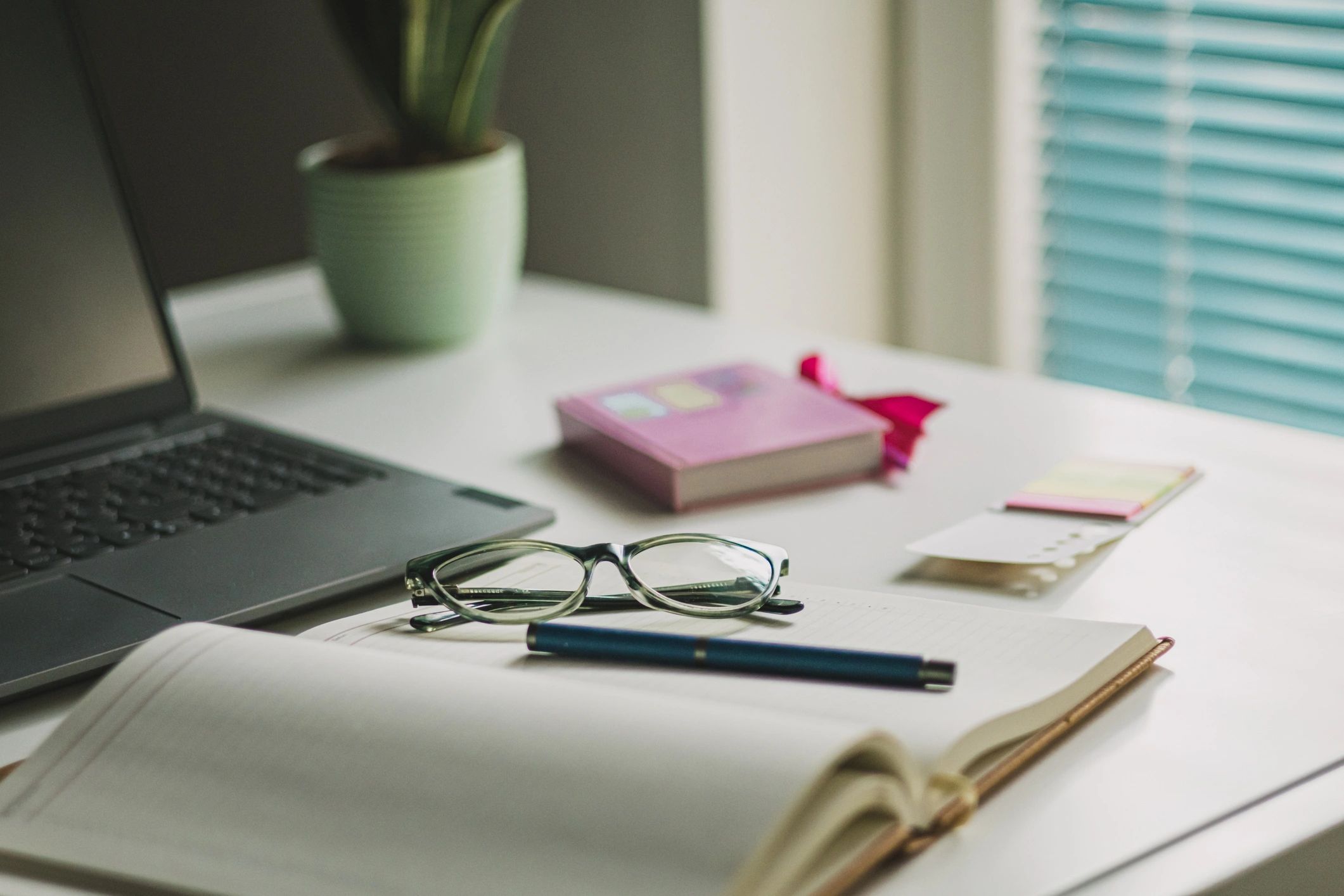Work desk with laptop and office supplies